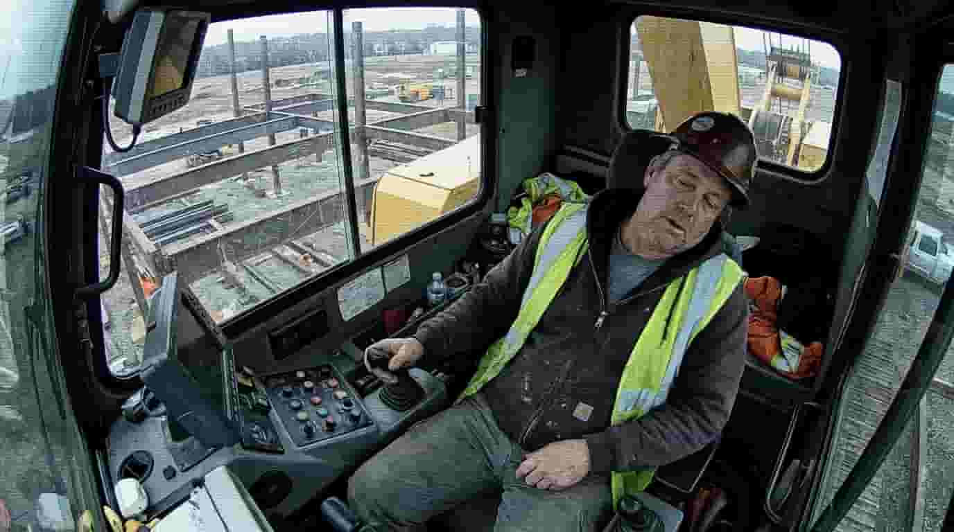 Tired worker sleeping on desk operator fatigue