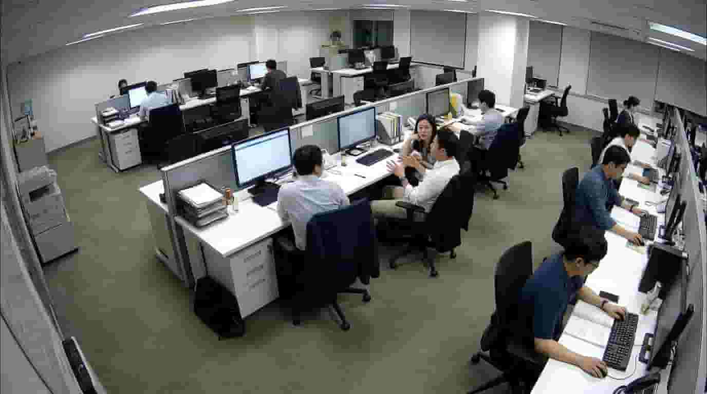 Employees gossiping and chatting at office